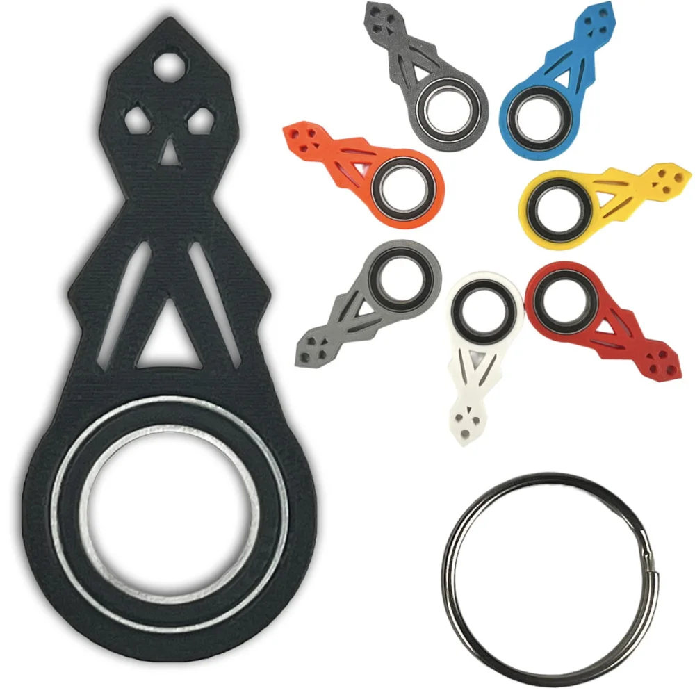 Keyrambit keychain with spinner designs